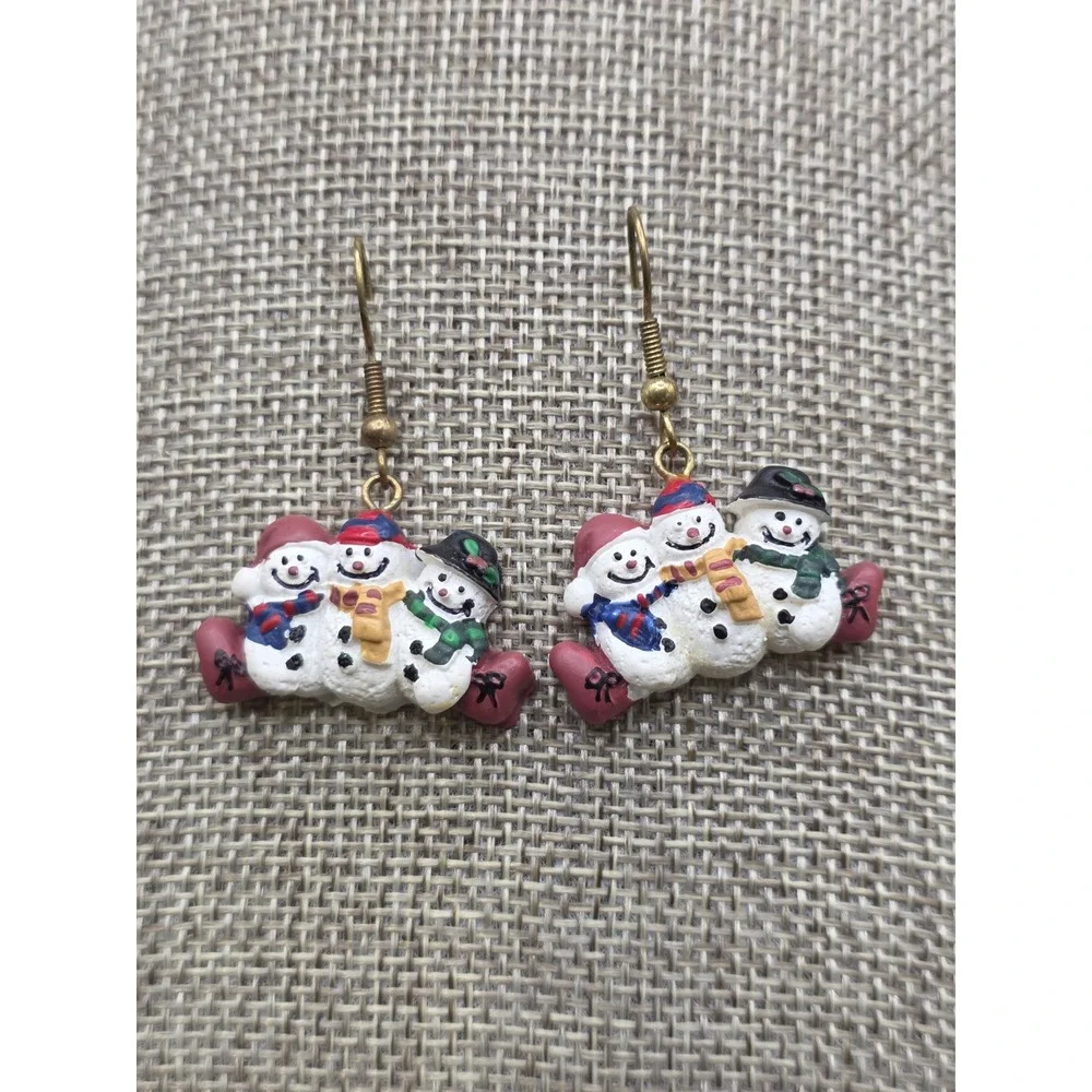 Christmas holiday drop earrings featuring a trio of snowmen made of resin